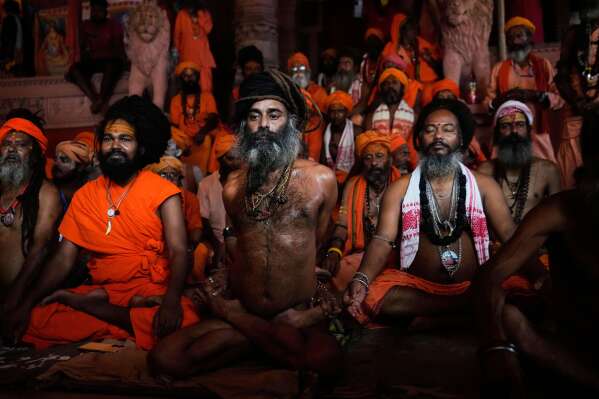 Hindu holy men display their yoga skills on International Day of Yoga at Kamakhya temple in Guwahati, Saturday, June 21, 2025. (AP Photo/Anupam Nath)
