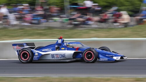 Alex Palou (10) accelerates on the main straight out of Turn 14 during an IndyCar auto race, Sunday, June 18, 2023, at Road America near Elkhart Lake, Wis. (Gary C. Klein/The Sheboygan Press via AP)
