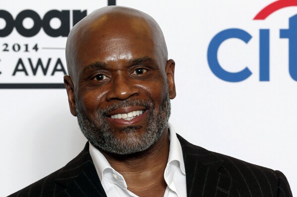 FILE - L.A. Reid poses in the press room at the Billboard Music Awards in Las Vegas, May 18, 2014. Antonio “L.A.” Reid, the Grammy-winning music executive who influenced the career of artists including Pink, Usher and Mariah Carey, was sued by a former music executive Wednesday, Nov. 8, 2023, who contends that he sexually assaulted her and derailed her career in retaliation. (Photo by Eric Jamison/Invision/AP, File)