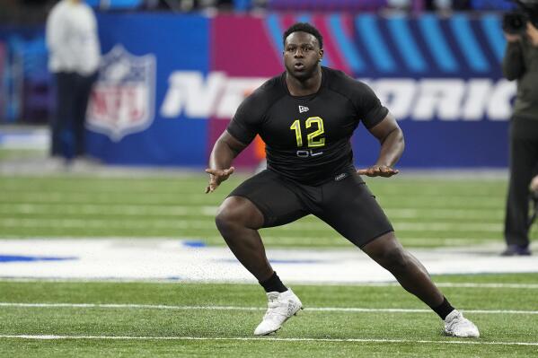 FILE - North Carolina State offensive lineman Ikem "Ickey" Ekwonu runs a drill during the NFL football scouting combine, Friday, March 4, 2022, in Indianapolis. The Jaguars have the No. 1 pick in the NFL Draft for the second consecutive year. Alabama left tackle Evan Neal or North Carolina State’s Ikem “Ickey” Ekwonu seemingly make as much sense for Jacksonville as Michigan standout pass rusher and betting favorite Aidan Hutchinson.(AP Photo/Darron Cummings, File)