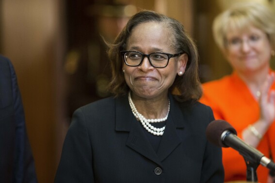FILE - Judge Natalie E. Hudson smiles as she is appointed to the Minnesota Supreme Court at the Minnesota Judicial Center, Tuesday, Aug. 18, 2015, in St. Paul, Minn. Gov. Tim Walz on Wednesday, Aug. 23, 2023, promoted Hudson to be chief justice of the Minnesota Supreme Court, making her the first Black person to lead the state's highest court, and named his former general counsel, Karl Procaccini, to fill Hudson's spot as associate justice. (Renee Jones Schneider/Star Tribune via AP, File)