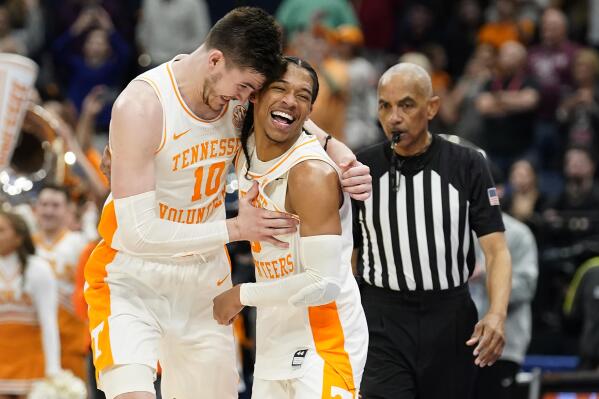 Tennessee forward John Fulkerson (10) and guard Zakai Zeigler (5) celebrate after the team defeated Texas A&M in an NCAA men's college basketball Southeastern Conference tournament championship game, Sunday, March 13, 2022, in Tampa, Fla. (AP Photo/Chris O'Meara)