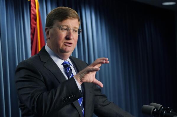 Mississippi Gov. Tate Reeves explains to reporters some of the line items that he vetoed from the appropriations allocated by the state Legislature, Thursday, April 28, 2022, in Jackson, Miss. (AP Photo/Rogelio V. Solis)