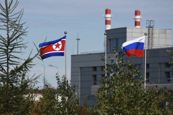 FILE - North Korean and Russian flags are seen at the Vostochny cosmodrome outside the city of Tsiolkovsky, about 200 kilometers (125 miles) from the city of Blagoveshchensk in the far eastern Amur region, Russia, on Sept. 13, 2023. South Korea, the U.S. and Japan strongly condemned what they call North Korea’s supply of munitions and military equipment to Russia, saying Thursday, Oct. 26 that such weapons shipments sharply increase the human toll of Russia’s war in Ukraine. (Vladimir Smirnov, Sputnik, Kremlin Pool Photo via AP, File)