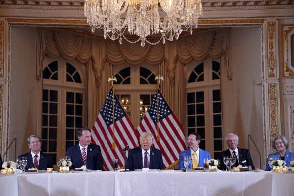 President-elect Donald Trump speaks during a meeting with Republican governors at Mar-a-Lago, Thursday, Jan. 9, 2025, in Palm Beach, Fla., as Georgia Gov. Brian Kemp, Virginia Gov. Glenn Youngkin, Lousiana Gov. Jeff Landry, South Carolina Gov. Henry McMaster and Susie Wiles listen. (AP Photo/Evan Vucci)