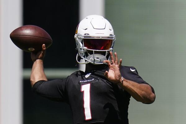 FILE - Arizona Cardinals quarterback Kyler Murray throws a pass as he takes part in drills at the NFL football team's practice facility Tuesday, June 14, 2022, in Tempe, Ariz. The Cardinals have shown improvement during quarterback Kyler Murray's first three seasons, progressing from one of the league's worst teams to a spot in the NFC Wild Card game last year. (AP Photo/Ross D. Franklin, File)