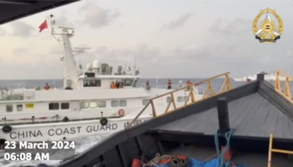 In this screen grab from video provided by the Armed Forces of the Philippines, a Chinese coast guard ship tries to block a Philippine resupply vessel Unaizah May 4 as it approaches Second Thomas Shoal, locally called Ayungin shoal, at the disputed South China Sea on Saturday, March 23, 2024. (Armed Forces of the Philippines via AP)