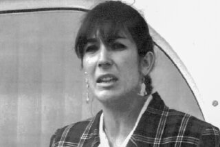FILE - In this Nov. 7, 1991, file photo, Ghislaine Maxwell, daughter of late British publisher Robert Maxwell, reads a statement expressing her family's gratitude to Spanish authorities after recov...