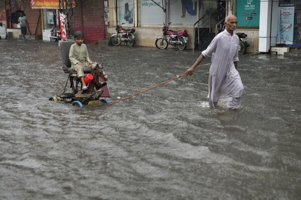 Heavy monsoon rains return to Pakistan a year after deadly floods | AP News