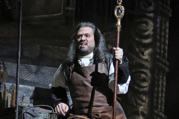 FILE - Opera singer David Daniels performs as Prospero during the final dress rehearsal of "The Enchanted Island," at the Metropolitan Opera in New York on Dec. 28, 2011. A renowned opera singer and his husband have pleaded guilty to sexually assaulting another singer in Houston. Countertenor Daniels, 57, of Ann Arbor, Michigan, and Scott Walters, 40, entered the pleas Friday, Aug. 4, 2023, after a jury was assembled for the trial of the pair on first-degree felony charges of aggravated sexual assault. (AP Photo/Mary Altaffer, File)
