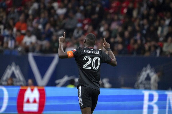 D.C. United forward Christian Benteke celebrates after scoring against the Vancouver Whitecaps during the first half of an MLS soccer game in Vancouver, British Columbia, Saturday, Sept. 30, 2023. (Ethan Cairns/The Canadian Press via AP)