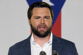 FILE - JD Vance, the venture capitalist and author of "Hillbilly Elegy," addresses a rally, July 1, 2021, in Middletown, Ohio. As war rages in Ukraine, ties to business deals involving Russia are threatening potential political fallout to candidates in Ohio's crowded Republican primary for an open U.S. Senate seat. (AP Photo/Jeff Dean, File)