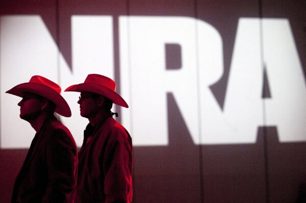 FILE - In this May 4, 2013, file photo, National Rifle Association members listen to speakers during the NRA's annual Meetings and Exhibits at the George R. Brown Convention Center in Houston. The Los Angeles City Council, Tuesday, Jan. 21, 2020 repealed a law requiring companies that want city contracts to disclose whether they have ties to the NRA. The 12-0 vote comes weeks after a judge blocked the city from enforcing the ordinance.(Johnny Hanson/Houston Chronicle via AP, File)