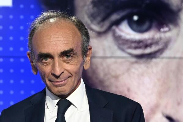 French far-right media pundit Eric Zemmour poses prior to a televised debate with French far-left leader Jean-Luc Melenchon on Sept.23, 2021 in Paris. French far-right TV pundit Eric Zemmour, expected to run for the presidency, stands trial Wednesday in Paris for inciting racial hatred after comments on unaccompanied migrant children. He has already been convicted twice for hate speech. (Bertrand Guay, Pool Photo via AP, File)