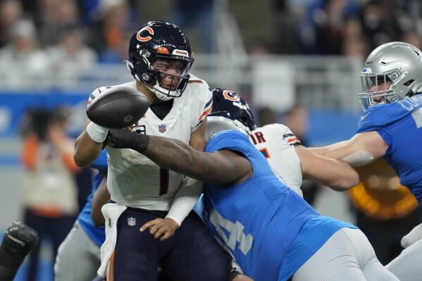 Bears stick with Fields throughout ugly loss to Lions | AP News