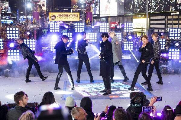 FILE - Members of BTS perform at the Times Square New Year's Eve celebration in New York on Dec. 31, 2019. The South Korean boy band BTS HAS won a leading four awards including best song for “Dynamite” and best group at the MTV Europe Music Awards Sunday, Nov. 8, 2020 while Lady Gaga took home the best artist prize.(Photo by Ben Hider/Invision/AP, File)