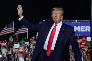 FILE - Former President Donald Trump arrives at a rally, Aug. 5, 2022, in Waukesha, Wis. A Wisconsin judge on Thursday, Aug. 10, 2023 allowed a civil lawsuit filed against 10 fake electors for former President Trump and two of his attorneys to proceed, rejecting a move to dismiss the case. (AP Photo/Morry Gash, File)