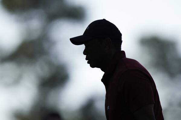 Tiger Woods walks to the tee on the fourth hole during final round at the Masters golf tournament at Augusta National Golf Club Sunday, April 14, 2024, in Augusta, Ga. (AP Photo/Charlie Riedel)