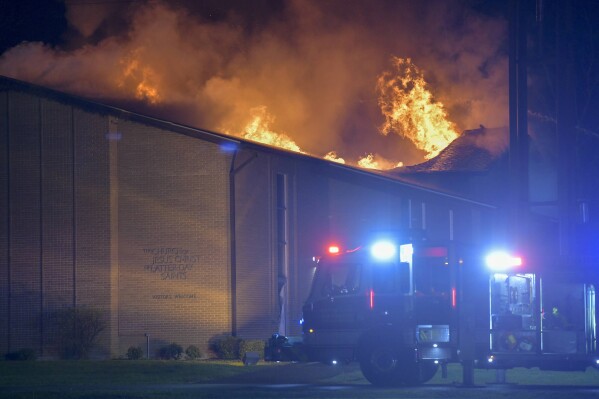 The Church of Jesus Christ of Latter Day Saints in Cape Girardeau, Mo., burns in a third alarm fire on Sunday, April 18, 2021. (Sarah Yenesel/The Southeast Missourian via AP, file)