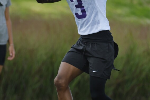 Minnesota Vikings wide receiver Jordan Addison catches a pass in drills during NFL football training camp Saturday, July 29, 2023, in Eagan, Minn. (AP Photo/Bruce Kluckhohn)