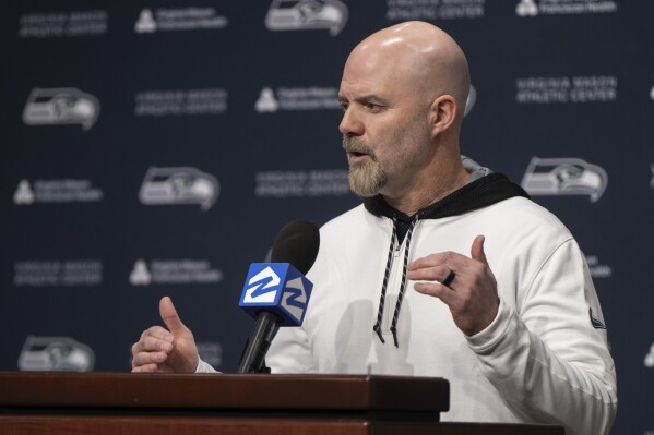 FILE - Seattle Seahawks NFL football offensive coordinator Ryan Grubb speaks to reporters during an introductory press conference, on Thursday, Feb. 15, 2024, in Renton. Seattle has seven picks entering this year’s draft, beginning with No. 16 overall in the first round. (AP Photo/Stephen Brashear, File)