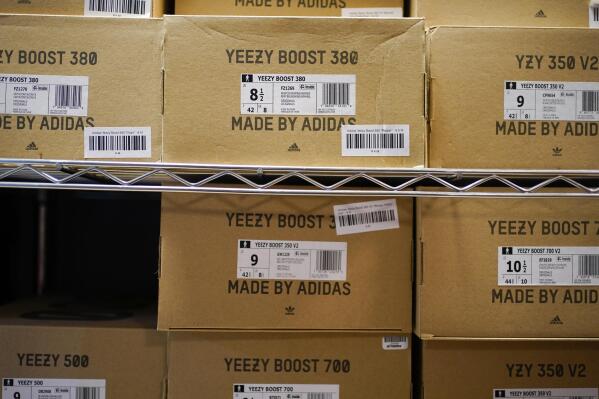 FILE - Boxes containing Yeezy shoes made by Adidas are seen at Laced Up, a sneaker resale store, in Paramus, N.J., Tuesday, Oct. 25, 2022. Adidas’ breakup with rapper Kanye West and the inability to sell his popular Yeezy line of shoes helped batter the company’s earnings at the end of last year. The German shoe and sportswear maker said Wednesday, March 8, 2023, that higher supply costs and slumping revenue in China also helped lead to a net loss of 513 million euros or $540 million in the fourth quarter. (AP Photo/Seth Wenig, File)