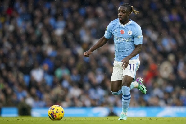 Manchester City's Jeremy Doku controls the ball during the English Premier League soccer match between Manchester City and Bournemouth at the Etihad stadium in Manchester, England, Saturday, Nov. 4, 2023. (AP Photo/Dave Thompson)