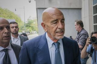 FILE - Tom Barrack, center, arrives at Brooklyn federal court, Monday, July 26, 2021, in New York. Federal prosecutors have spelled out more details of the allegations against Barrack, the chair of former President Donald Trump's inaugural committee, who's accused of secretly working as an agent for the United Arab Emirates to influence Trump's foreign policy. (AP Photo/Mark Lennihan, File)