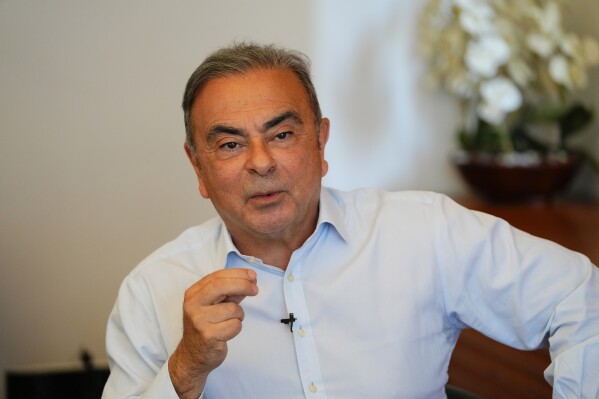 FILE - Former Nissan executive Carlos Ghosn speaks during an interview in Beirut, Lebanon on June 23, 2023. Ghosn, the former rock star businessman who fell from grace, is the subject of a multi-part documentary series, “Wanted: The Escape of Carlos Ghosn,