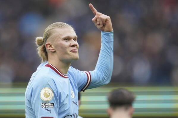 Manchester City's Erling Haaland celebrates after scoring his side's opening goal during the English Premier League soccer match between Manchester City and Wolverhampton at the Etihad Stadium in Manchester, England, Sunday, Jan. 22, 2023. (AP Photo/Dave Thompson)