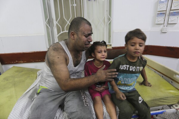 Palestinians wounded in an Israeli strike on the Gaza Strip wait for treatment in a hospital in Rafah on Monday, Oct. 30, 2023. (AP Photo/Hatem Ali)