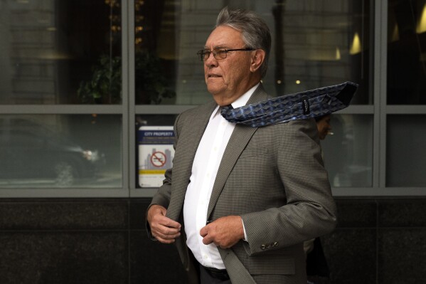 Former Philadelphia police detective Frank Jastrzembski leaves the Juanita Kidd Stout Center for Criminal Justice, Friday, April 5, 2024, in Philadelphia. Three long-retired Philadelphia police detectives, Martin Devlin, Manuel Santiago and Frank Jastrzembski, are accused of lying under oath at the 2016 retrial of a man the jury exonerated in a 1991 rape and murder. The case, if it proceeds to trial in November, would mark a rare time when police or prosecutors face criminal charges for flawed work that leads to wrongful convictions. (AP Photo/Joe Lamberti)