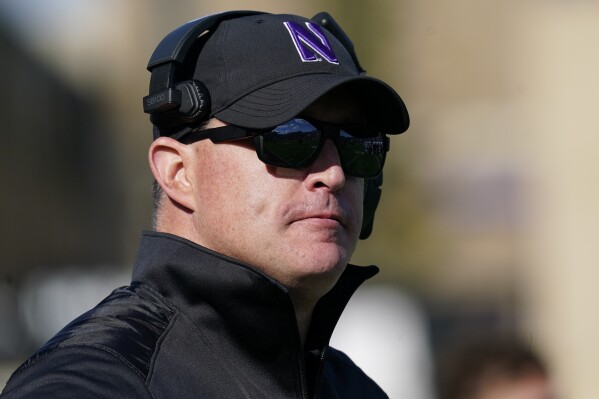 FILE - Northwestern head coach Pat Fitzgerald watches his team during the second half of an NCAA college football game against Rutgers in Evanston, Ill., Oct. 16, 2021. Northwestern has fired Fitzgerald Monday, July 10, 2023, amid a hazing scandal that called into question his leadership of the program and damaged the university's reputation after it mishandled its response to the allegations. (AP Photo/Nam Y. Huh, File)