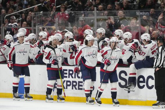 Washington Capitals players celebrate a goal by Rasmus Sandin (38) during the second period of an NHL hockey game against the Los Angeles Kings Monday, March 6, 2023, in Los Angeles. (AP Photo/Jae C. Hong)