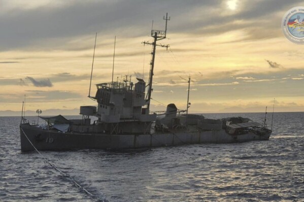 In this handout photo, provided by the Armed Forces of the Philippines Public Affairs Office (PAO), the decommissioned Philippine Navy BRP Miguel Malvar (PS-19) takes on water before sinking while being positioned as vessel target prompting the cancellation of a live-fire drill as part of a joint US-Philippines military exercises called Balikatan or "shoulder to shoulder" approximately 30 nautical miles west of San Antonio, Zambales, Philippines on Monday, May 5, 2025. (Armed Forces of the Philippines PAO via AP)