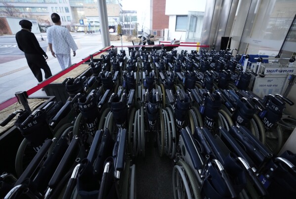 Wheelchairs are placed at Seoul National University Hospital in Seoul, South Korea, Tuesday, Feb. 20, 2024. South Korean trainee doctors collectively walked off their jobs Tuesday to escalate their protest of a government medical policy, triggering cancellations of surgeries and other medical treatments at hospitals. (AP Photo/Ahn Young-joon)