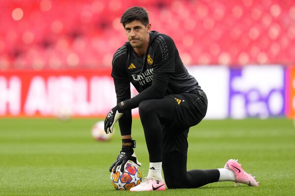 Real Madrid's goalkeeper Thibaut Courtois pauses during a training session ahead of the Champions League final soccer match between Borussia Dortmund and Real Madrid at Wembley Stadium in London , Friday, May 31, 2024.(AP Photo/Kirsty Wigglesworth)
