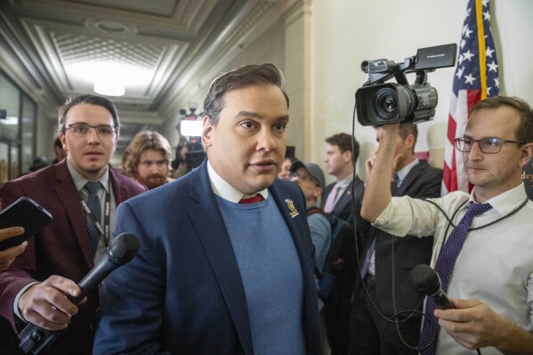 Rep. George Santos, R-N.Y., departs a House Republican closed-door caucus to decide who to nominate for speaker of the House, on Capitol Hill, Wednesday, Oct. 11, 2023, in Washington. (AP Photo/Alex Brandon)