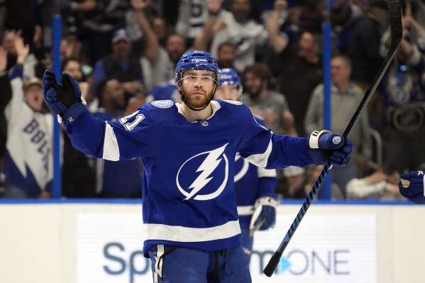 Tampa Bay Lightning center Brayden Point (21) celebrates his goal against the Seattle Kraken during the second period of an NHL hockey game Tuesday, Dec. 13, 2022, in Tampa, Fla. (AP Photo/Chris O'Meara)