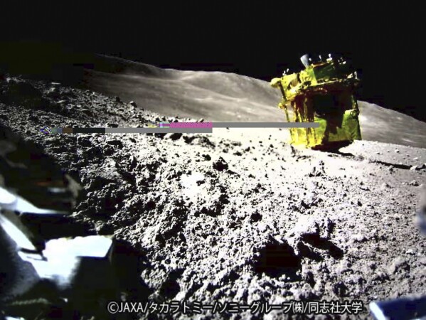 This image provided by the Japan Aerospace Exploration Agency (JAXA)/Takara Tomy/Sony Group Corporation/Doshisha University shows an image taken by a Lunar Excursion Vehicle 2 (LEV-2) of a robotic moon rover called Smart Lander for Investigating Moon, or SLIM, on the moon. (JAXA/Takara Tomy/Sony Group Corporation/Doshisha University via AP)