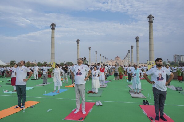 Indians perform yoga as they mark International Day of Yoga at Ambedkar Park, Lucknow, India, Saturday, June 21, 2025. (AP Photo/Rajesh Kumar Singh)