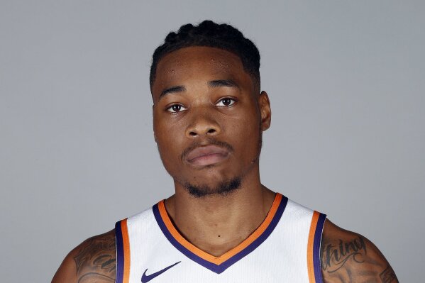 
              FILE - In this Sept. 24, 2018, file photo, Phoenix Suns' Richaun Holmes poses for a photograph during media day at the NBA basketball team's practice facility in Phoenix. Phoenix Suns big man Richaun Holmes was arrested for misdemeanor possession of cannabis after a Miami-area traffic stop. Twenty-five-year-old Holmes was arrested Tuesday night, May 22, 2019, along with former Brooklyn Nets forward James Webb III after authorities say the found a recently used marijuana joint inside their vehicle. (AP Photo/Matt York, File)
            
