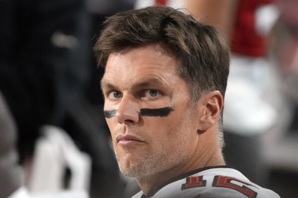 FILE - Tampa Bay Buccaneers quarterback Tom Brady looks on during the second half of an NFL football game against the Arizona Cardinals, Dec. 25, 2022, in Glendale, Ariz. NFL owners did not vote Tuesday, March 26, 2024, on Brady's bid to purchase a stake in the Las Vegas Raiders. (AP Photo/Rick Scuteri, File)