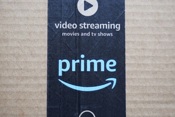 FILE - An Amazon Prime cardboard shipping box label is seen on March 17, 2023, in East Derry, N.H. Amazon Prime Day is here. And experts are reminding consumers to be wary of scams. (AP Photo/Charles Krupa, File)