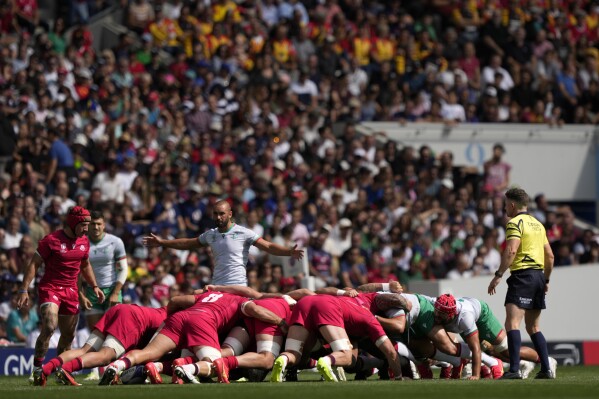 Teams contest a scrum during the Rugby World Cup Pool C match between Georgia and Portugal at the Stadium de Toulouse in Toulouse, France, Saturday, Sept. 23, 2023. (AP Photo/Lewis Joly)
