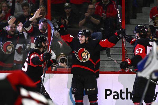 Ottawa Senators center Jacob Lucchini (36) celebrates his first career NHL goal during the second period of an NHL hockey game against the Buffalo Sabres in Ottawa, Ontario, Sunday, Jan. 1, 2023. (Justin Tang/The Canadian Press via AP)