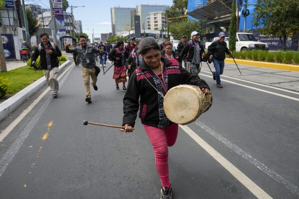 Indigenous people march for the resignation of the Attorney General Consuelo Porras in Guatemala City, Monday, Sept. 18, 2023. President-elect Bernardo Arévalo has called people to protest efforts to derail his presidency before he can take office and for the attorney general's resignation, due to its office's investigations related to the registration of Arévalo's Seed Movement party, and alleged fraud in the election. (AP Photo/Moises Castillo)