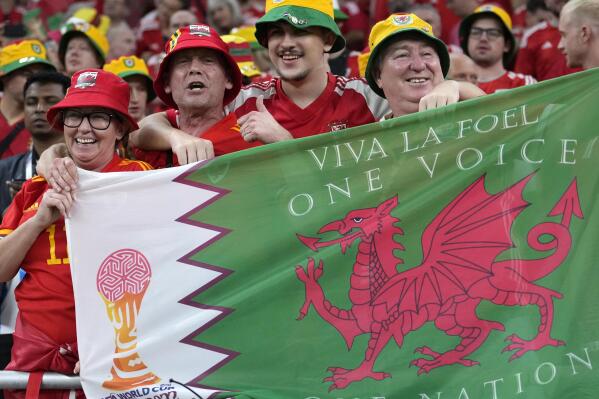 Fans cheer ahead the World Cup, group B soccer match between the United States and Wales, at the Ahmad Bin Ali Stadium in in Doha, Qatar, Monday, Nov. 21, 2022. (AP Photo/Ashley Landis)