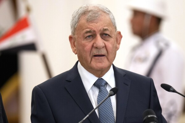 FILE - Iraqi President Abdul Latif Rashid speaks during a news conference as an ancient artifact brought back from Italy is displayed at the Peace Palace inside the Green Zone, in Baghdad, Iraq, on June 18, 2023. The Iraqi president announced Tuesday Sept. 19, 2023 that he will summon Turkey’s ambassador and hand him a formal letter of protest over recent Turkish airstrikes on Iraqi territory. (AP Photo/Hadi Mizban, File)