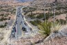 People walk and drive along Santa Fe County Road 98 to get to the Santuario de Chimayo during a Good Friday pilgrimage, Friday, April 7, 2023. (Eddie Moore/The Albuquerque Journal via AP, file)